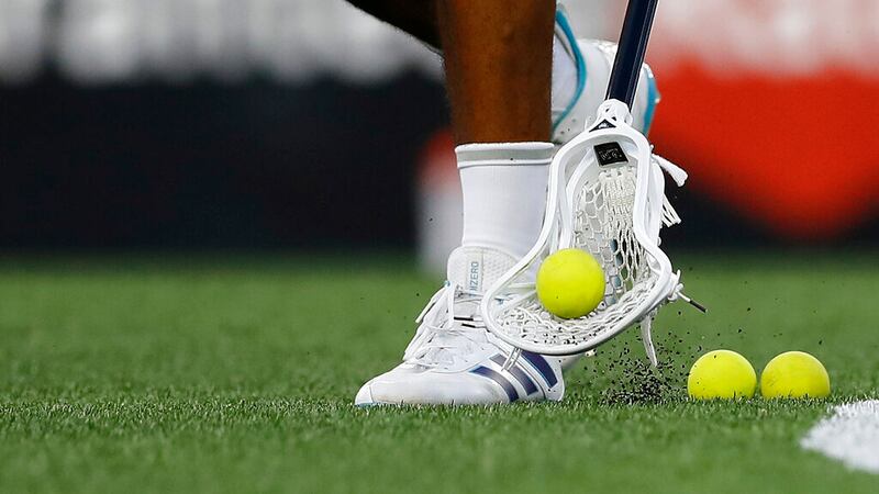A closeup, detail view of a lacrosse ball being picked up off the field before a Premier...