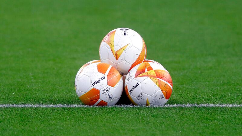 Balls are placed on the pitch ahead of the Europa League, round of 16, second leg soccer...
