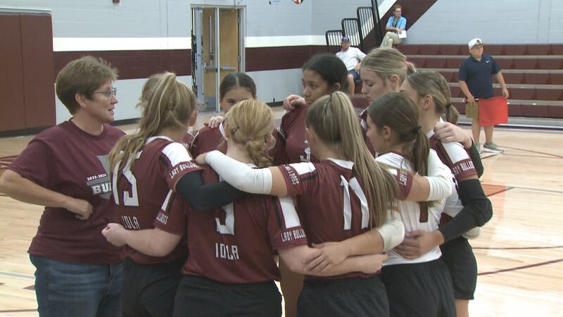 Iola volleyball team huddle
