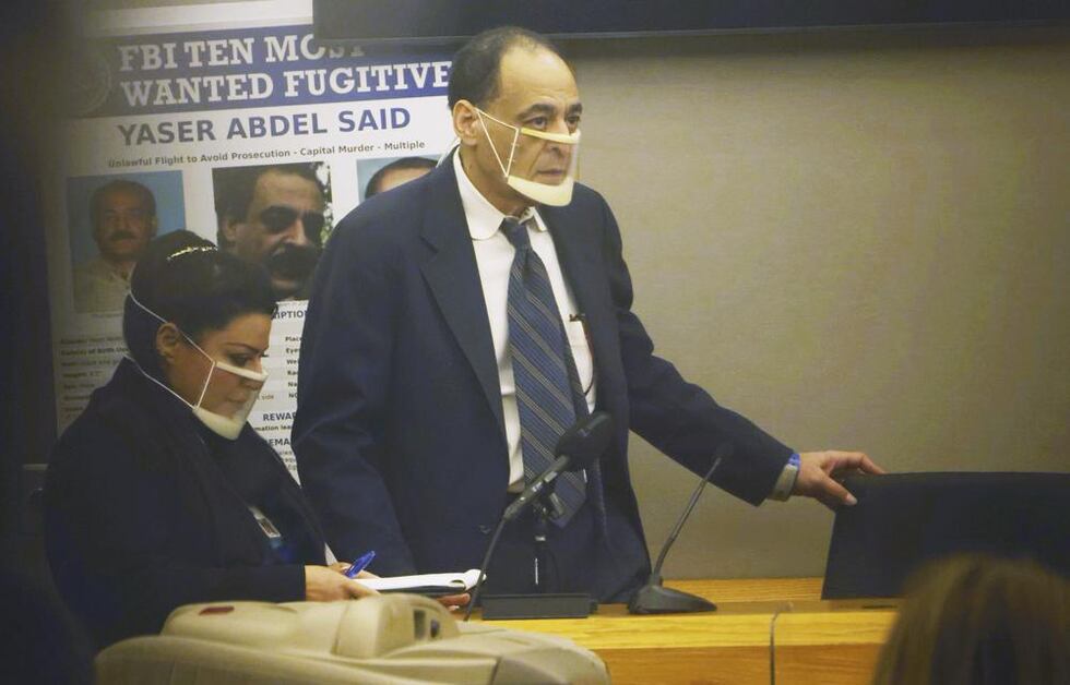 Yaser Said, 65, right, accused of killing his two teen daughters on New Year's Day 2008, takes...