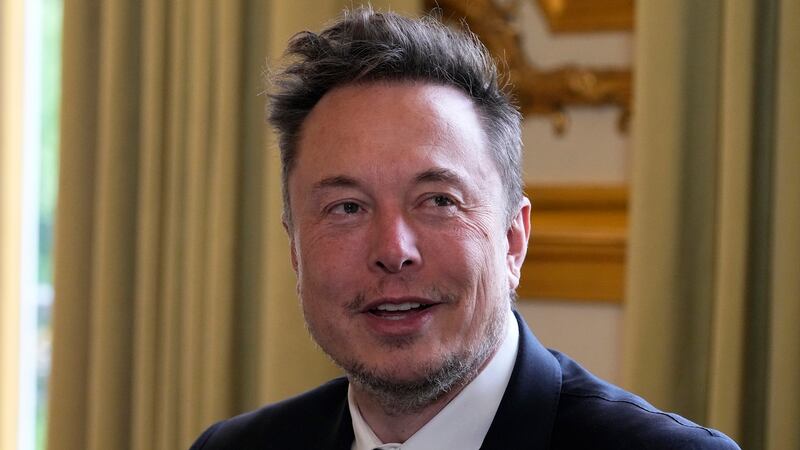 FILE - Twitter, now X. Corp., and Tesla CEO Elon Musk poses before his talks with French...