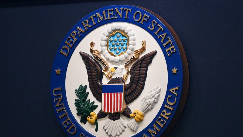 The State Department seal is seen on the briefing room lectern at the State Department in...