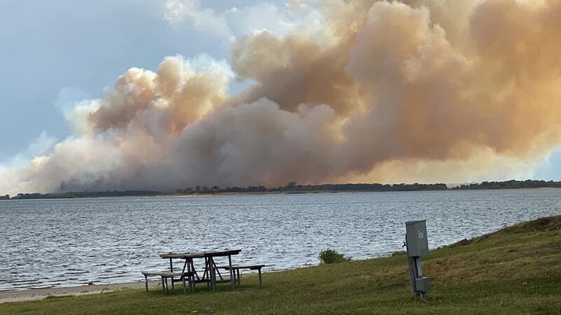A large wildfire near Lake Somerville is now fully contained, according to fire officials.