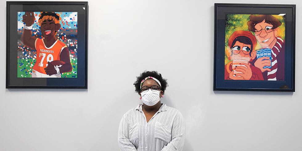 Sam Houston State University student Jada Jackson with two of the eight pieces of her art...