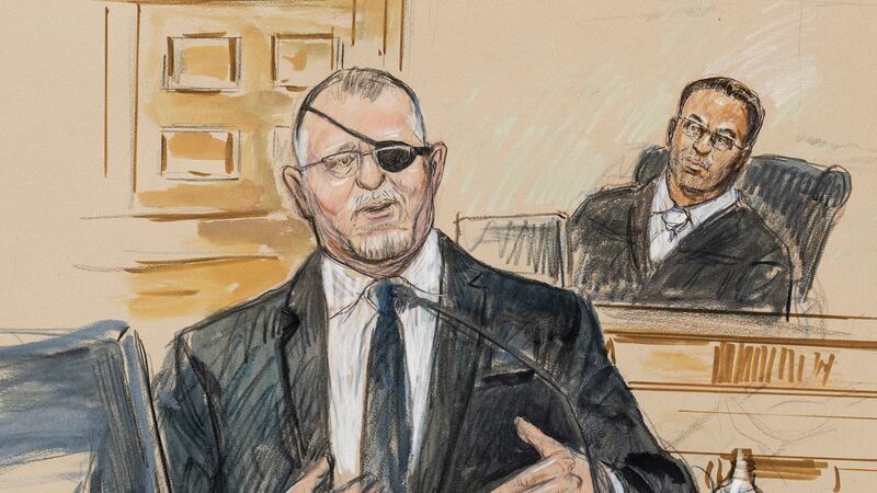 FILE - This artist sketch depicts the trial of Oath Keepers leader Stewart Rhodes, left, as he...